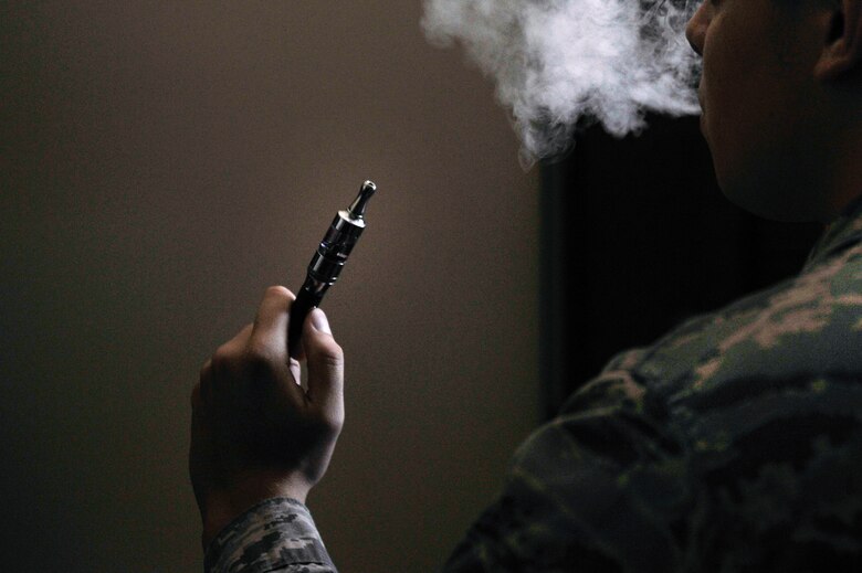 An Airman holds an electronic cigarette at Scott Air Force Base, Illinois, Aug. 13, 2014. The Centers for Disease Control and Prevention is investigating the more than 2,000 cases of e-cigarette, or vaping, product use associated lung injury that have occurred across the country. (U.S. Air Force photo by Airman 1st Class Erica Crossen)