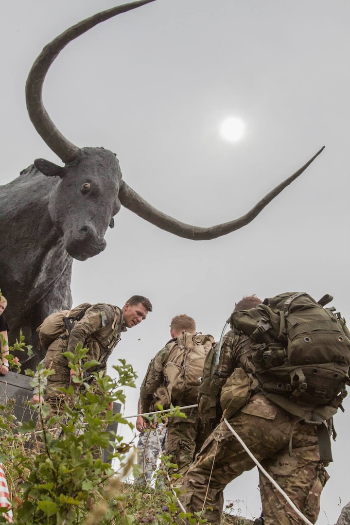 Soldiers from the Long Range Surveillance team attached to Troop C, 1st Squadron, 158th Cavalry Regiment, Maryland National Guard, climb toward a statue of Tarvas, Rakvere's medieval mascot, during the second annual Admiral Pitka Recon Challenge Aug. 9, 2014, in Rakvere, Estonia. Hosted by the Estonian Defense League and including Soldiers from the 173rd Airborne Brigade and the Maryland National Guard, this three-day competition tested the strength, speed, endurance, intelligence and willpower of 26 teams from six countries through a series of obstacles and simulations along an 81-mile route through Estonia's countryside. The Maryland National Guard and Estonian armed forces have been partners through the State Partnership Program for more than 20 years. 