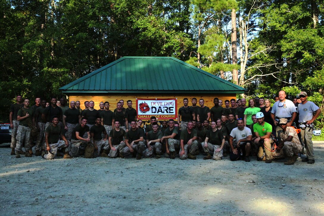 Marines with Marine Tactical Air Command Squadron 28 gather for a photo with the Devil Dog Dare course staff at Marine Corps Air Station Cherry Point, N.C., Aug. 13, 2014. MTACS-28 was the first 2nd Marine Aircraft Wing squadron to complete the course. 