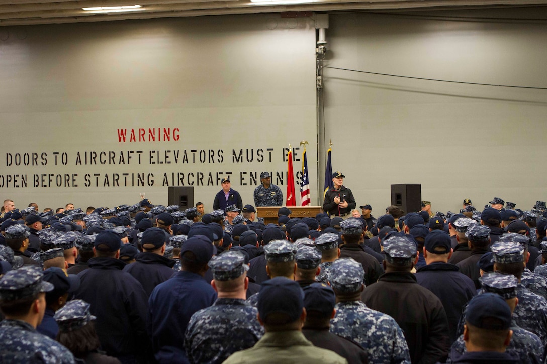 Secretary of the Navy Ray Mabus addresses the Marines and Sailors of Special Purpose Marine Air Ground Task Force South and the future amphibious assault ship USS America (LHA 6) during an all hands meeting held in the hangar bay, Aug. 19, 2014. During his visit, Mabus also toured the ship, had dinner with the Marines and Sailors on the mess deck and attended an ice cream social. Visits like this remind the Marines and Sailors with America and the SPMAGTF of the significance of the work they are doing. SPMAGTF-South is embarked aboard America in support of her maiden transit, “America Visits the Americas.” Through partner-nation activities, theater security events and key leader engagements, the transit aims to demonstrate the flexibility, utility and unparalleled expeditionary capability the Navy-Marine Corps team provides our nation and partners. (U.S. Marine Corps Photo by Cpl. Donald Holbert/ Released)