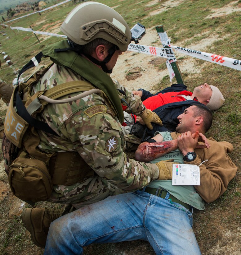 A Chilean Navy Rescue medic provides care to role players during a training scenario designed to simulate a major natural disaster in Pichidangui, Chile August 18, 2014, as part of Partnership of the Americas 2014. Representatives from Argentina, Brazil, Canada, Chile, Colombia, Mexico, Paraguay, and the United States are participating in POA 2014 from August 11-22, 2014. This exercise is designed to enhance joint and combined interoperability, increase the combined capability to execute Amphibious Operations, Peace Support Operations, and Humanitarian Assistance/Disaster Relief missions, and further develop strong and lasting relationships the U.S. Marine Corps has established with partner nation’s naval infantries/marine corps.