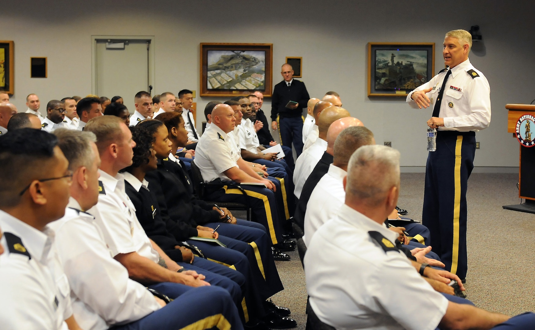 Sgt. Maj. of the Army Raymond Chandler III discusses the Army profession with enlisted Soldiers assigned to the national capital region and the Army National Guard Readiness Center in a town hall meeting in Arlington, Va., Aug. 15, 2014.  Chandler's visit marked the first time a sitting sergeant major of the Army visited the readiness center. 