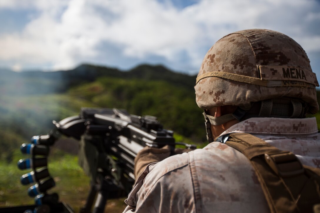 Sergeant Oscar Mena fires a Mk-19 40mm heavy machine gun during a crew-served weapons familiarization shoot for Battalion Landing Team 3rd Battalion, 5th Marines, 31st Marine Expeditionary Unit, Aug. 20. Live-fire events like this keep the Marines proficient with the weaponry in the battalion. The Marines fired the Mk-19 40mm heavy machine gun, the M240G medium machine gun and the M2 .50 Caliber machine gun. Mena is a machine-gun section leader with Company K, BLT 3/5, 31st MEU, and a native of Anaheim, Calif. The 31st MEU is the force of choice for the Asia-Pacific region and is the only continuously forward-deployed MEU.