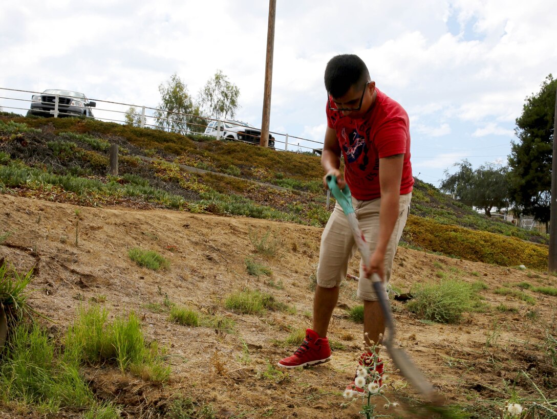 CAMP PENDLETON, Calif. - Cpl. Edgar Duram, a heavy equipment specialist with 1st Maintenance Battalion, aides the Stepp Stables by volunteering here, Aug. 20.  

Duram seeks out volunteer work with his fellow Marines at the battalion to improve the the Corps and Community around them.
