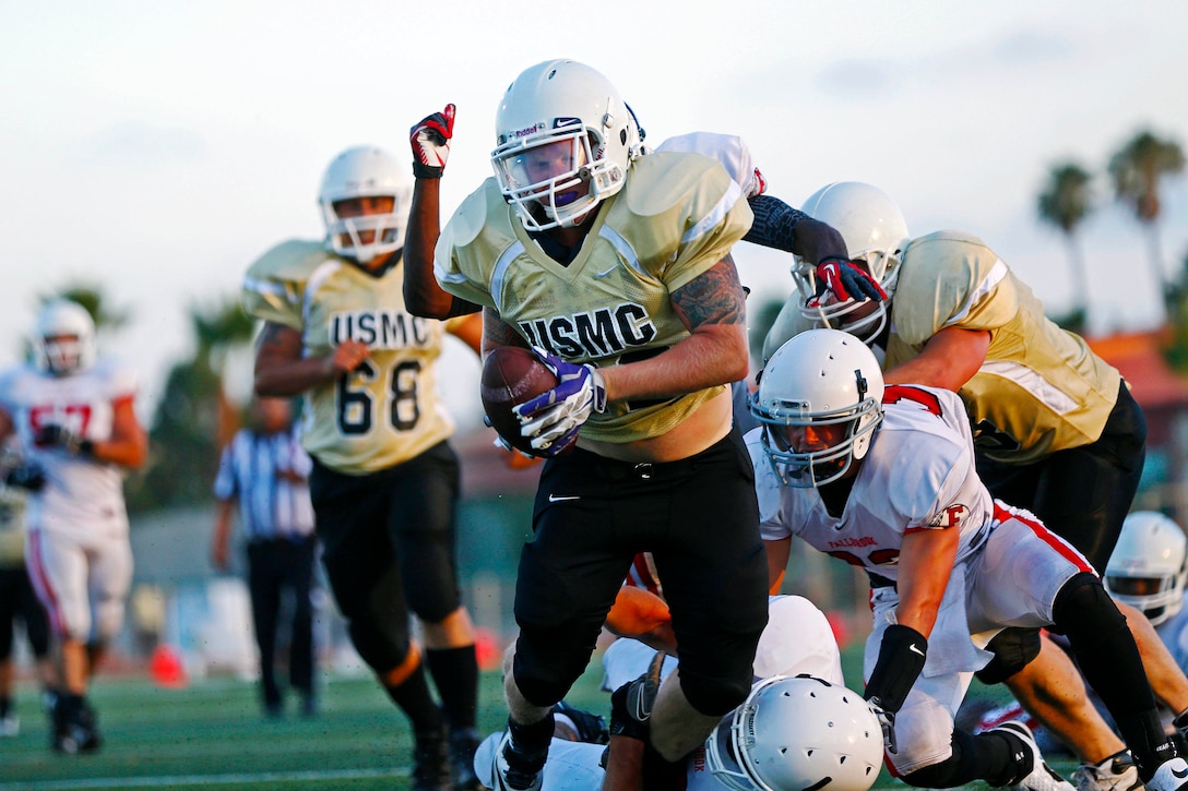 The 1st Light Armored Reconnaissance Battalion Highlanders controlled the field and finished victorious, 28 – 8 against the 1st Marine Logistics Group Beast, during the 2nd week of the Commanding Generals Cup Football League, at the Paige Fieldhouse football field, Camp Pendleton, California, Aug. 19, 2014.

