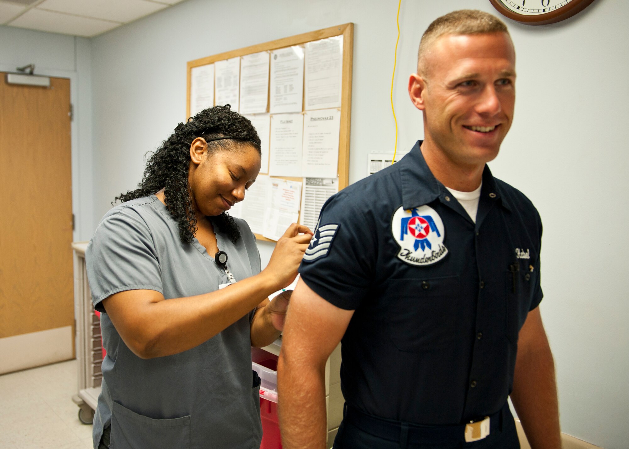 Mellissa Urban, 99th Medical Group contracted licensed practical nurse, gives a vaccination to Tech. Sgt. Allan Habel, U.S. Air Force Thunderbirds quality assurance inspector, at the Mike O’Callaghan Federal Medical Center, Nellis Air Force Base, Nev., Aug. 19, 2014. Receiving immunizations for preventable diseases is one of the best ways to maintain strong health. (U.S. Air Force photo by Airman 1st Class Thomas Spangler)