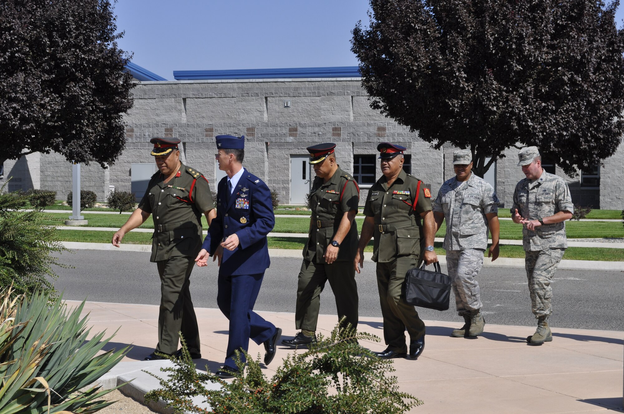 The 152nd Airlift Wing opened its doors to Brig. Gen. 'Uta'atu, Lt. Col. Lord Ve'ehala, and Senior Warrant Officer Kava of the Kingdom of Tonga’s military on August 20. While on the walking tour, from left to right: Brig. Gen. 'Uta'atu, 152nd Airlift Wing Commander, Col. Karl Stark, Lt. Col. Lord Ve'ehala, Senior Warrant Officer Kava, Staff Sgt. Malakai Niko, and 152nd Airlift Wing Chief of Staff, Lt. Col. David Manson. (Photo by Master. Sgt. Paula Macomber, 152nd Airlift Wing Public Affairs/RELEASED.)