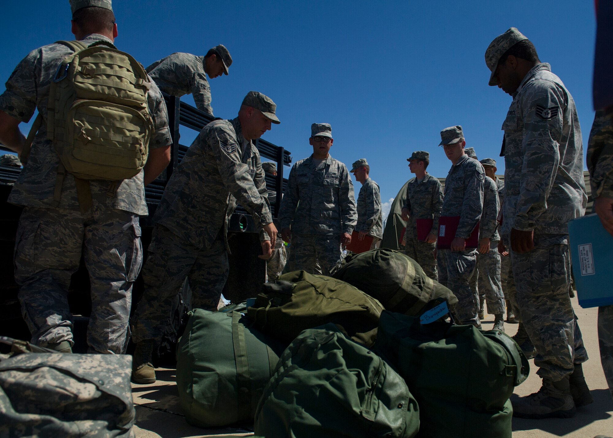 Members of Team Holloman participate in a three-day deployment exercise at Holloman Air Force Base, N.M., Aug. 19. The exercise was a part of the Air Force’s Commanders Inspection Program. The program is designed to test a unit’s ability to accomplish the mission with little warning, and provides feedback on areas of excellence or areas that need improvement. The program specifically focuses on the bases ability to rapidly deploy combat-ready Airmen and equipment world-wide. (U.S. Air Force photo by Senior Airman Leah Ferrante/ Released)