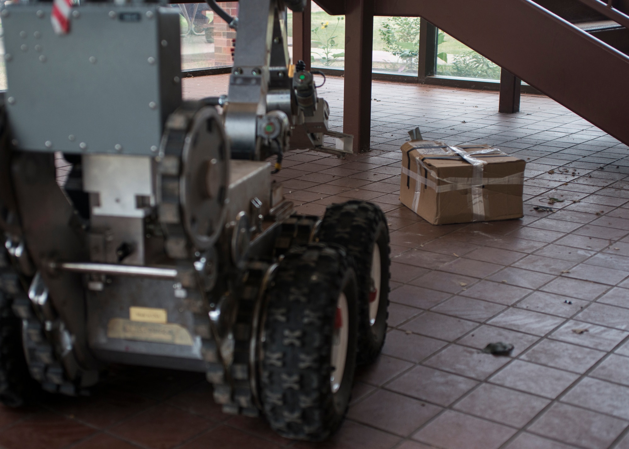 An F6A Explosive Ordnance Disposal robotic system is maneuvered in front of a suspicious package during a training scenario Aug. 12, 2014, at Dyess Air Force Base, Texas. EOD teams from Dyess and Fort Hood, Texas, trained here Aug. 11- 12 to increase knowledge and experience for home station and deployment operations. (U.S. Air Force photo by Senior Airman Peter Thompson/Released)