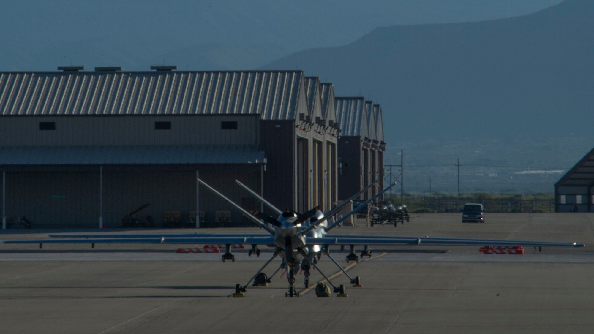An MQ-9 Reaper sits on the flight line of Holloman Air Force Base, N.M., Aug. 19, prior to maintenance that will keep it flying and training the next generation of Air Force pilots and sensor operators. The MQ-9 Reaper is a medium-to-high altitude, long endurance unmanned aircraft system. The MQ-9's primary mission is as a persistent hunter-killer against emerging targets to achieve joint force commander objectives. The MQ-9's alternate mission is to act as an intelligence, surveillance and reconnaissance asset, employing sensors to provide real-time data to commanders and intelligence specialists at all levels.(U.S. Air Force photo by Airman 1st Class Aaron Montoya/Released)