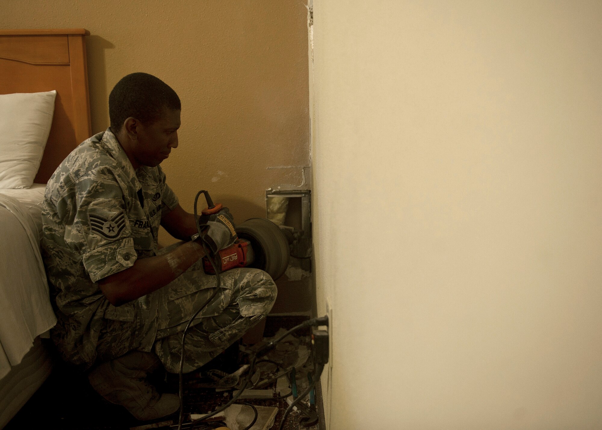 Staff Sgt. Alan Franklin, 99th Civil Engineer Squadron water and fuels systems maintenance craftsman, uses a hand auger, or plumbing snake, to unclog a drain pipe at the Nellis Inn on Nellis Air Force Base, Nev., Aug. 19, 2014. The pipe Franklin was unclogging was the main drain for six other lodging rooms, which were not available for guests to stay in until the clog abated. The water and fuels systems maintenance shop is comprised of approximately 35 Airmen and civilians who work around-the-clock to take care of the base’s fire suppression systems, backflow prevention systems, plumbing systems, and the natural gas hydrants, pipes, tanks and valves. (U.S. Air Force photo by Staff Sgt. Siuta B. Ika)
