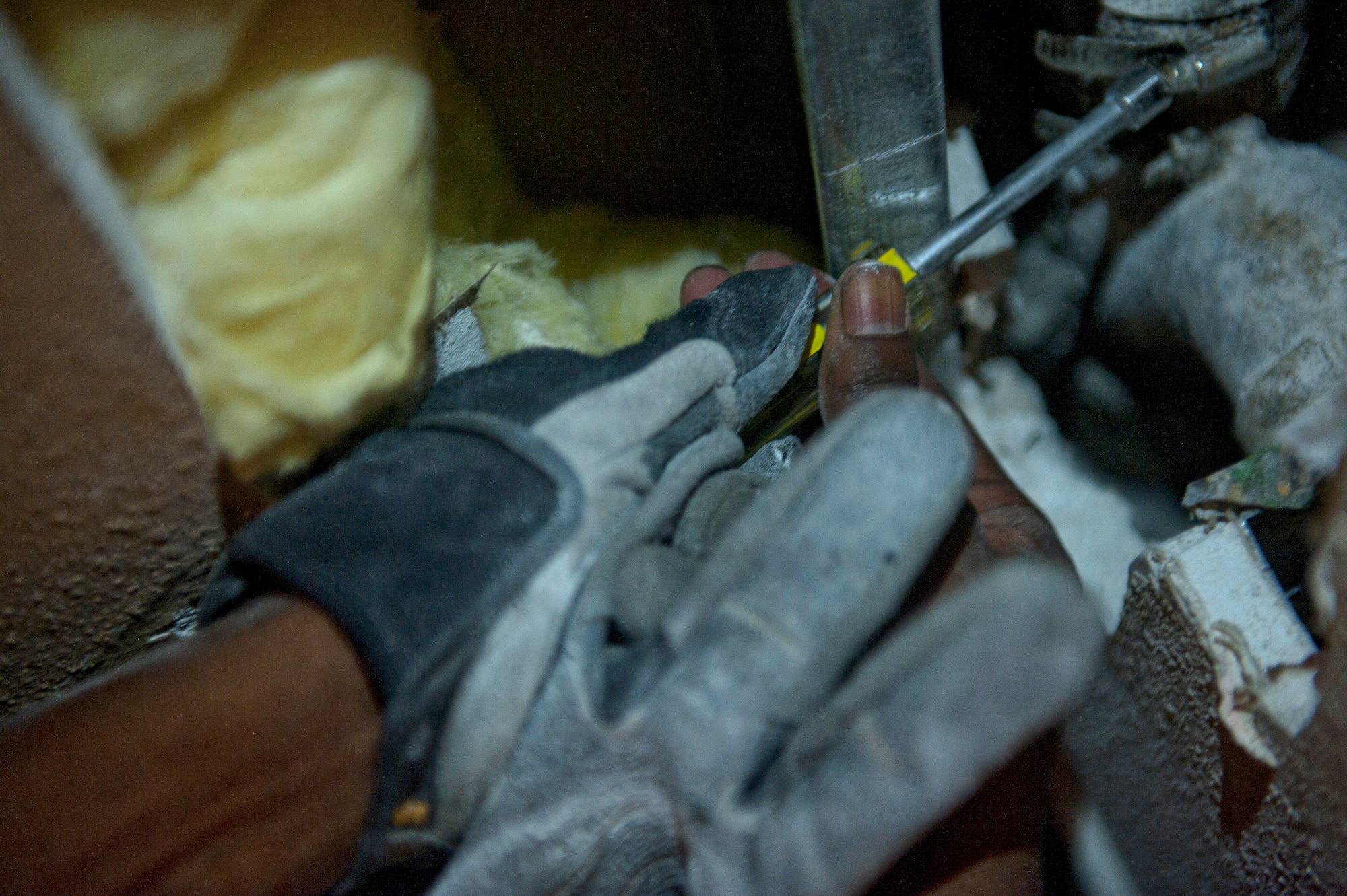 Staff Sgt. Alan Franklin, 99th Civil Engineer Squadron water and fuels systems maintenance craftsman, loosens a screw on a drain pipe in order to reach the cleanout of the pipe at the Nellis Inn on Nellis Air Force Base, Nev., Aug. 19, 2014. Once Franklin could reach the cleanout, he was able to unclog the pipe without taking it out of the wall or replacing it. Since January 2014, Franklin and other water and fuels systems maintenance technicians have completed 1,860 job orders and spent 5,634 preventative-maintenance hours to ensure the base’s continuous water flow is uninterrupted. (U.S. Air Force photo by Staff Sgt. Siuta B. Ika)