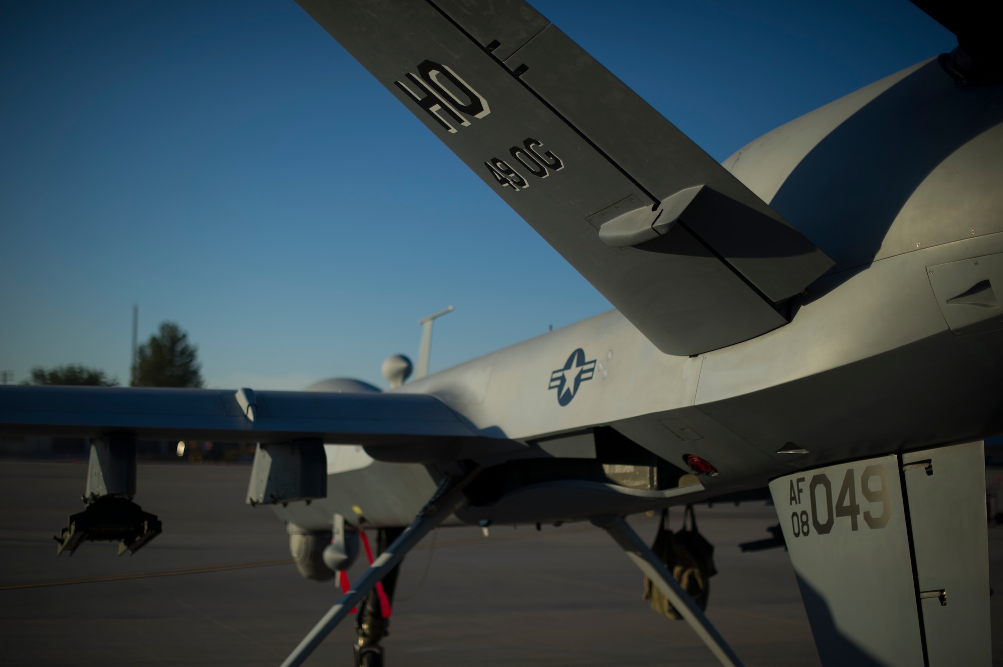 An MQ-9 Reaper sits on the flight line of Holloman Air Force Base, N.M., Aug. 19, prior to maintenance that will keep it flying and training the next generation of Air Force pilots and sensor operators. The MQ-9 Reaper is a medium-to-high altitude, long endurance unmanned aircraft system. The MQ-9's primary mission is as a persistent hunter-killer against emerging targets to achieve joint force commander objectives. The MQ-9's alternate mission is to act as an intelligence, surveillance and reconnaissance asset, employing sensors to provide real-time data to commanders and intelligence specialists at all levels.(U.S. Air Force photo by Airman 1st Class Aaron Montoya/Released)