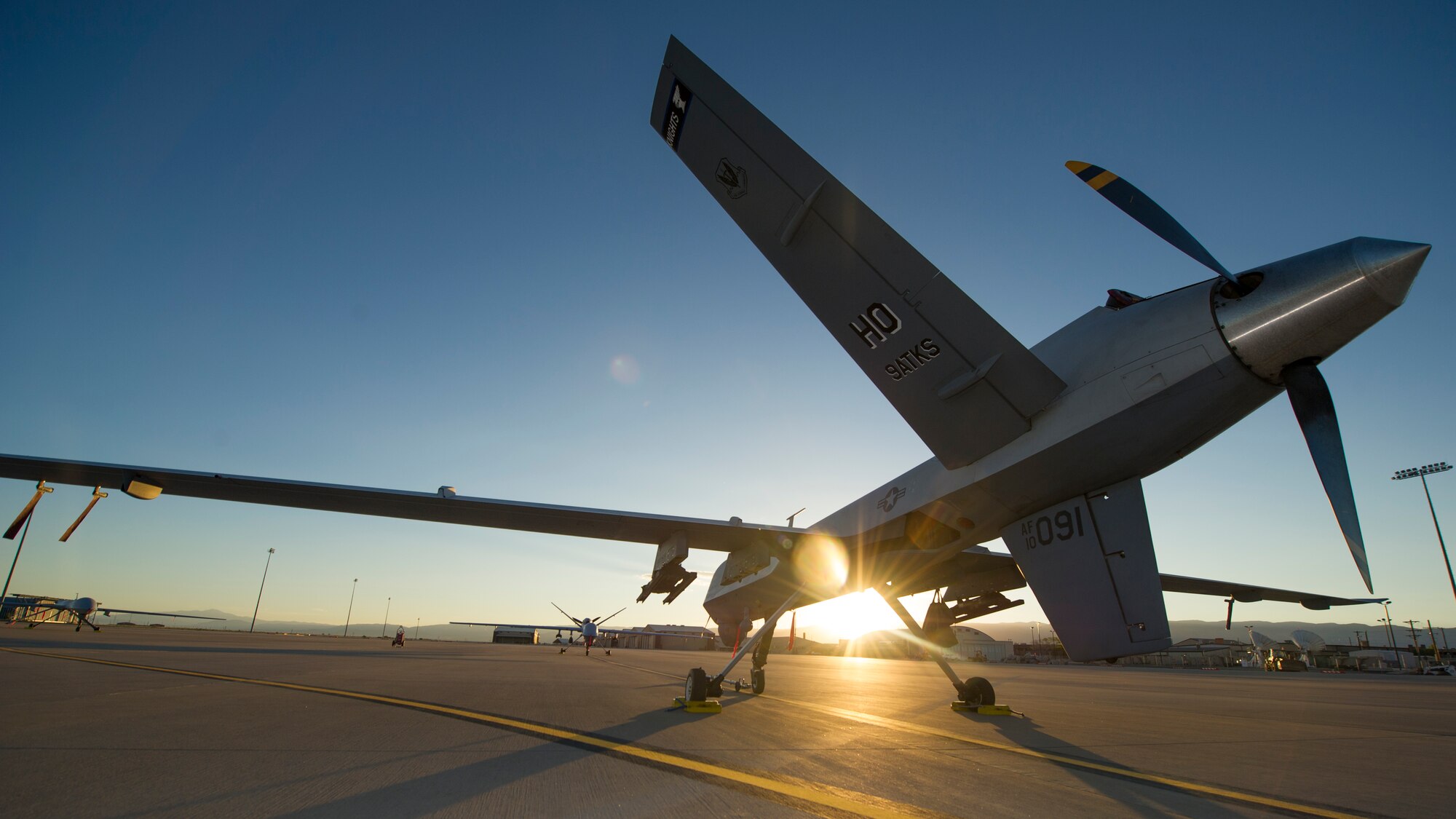 An MQ-9 Reaper sits on the flight line of Holloman Air Force Base, N.M., Aug. 19, prior to maintenance that will keep it flying and training the next generation of Air Force pilots and sensor operators. The MQ-9 Reaper is a medium-to-high altitude, long endurance unmanned aircraft system. The MQ-9's primary mission is as a persistent hunter-killer against emerging targets to achieve joint force commander objectives. The MQ-9's alternate mission is to act as an intelligence, surveillance and reconnaissance asset, employing sensors to provide real-time data to commanders and intelligence specialists at all levels.(U.S. Air Force photo by Airman 1st Class Aaron Montoya/Released)