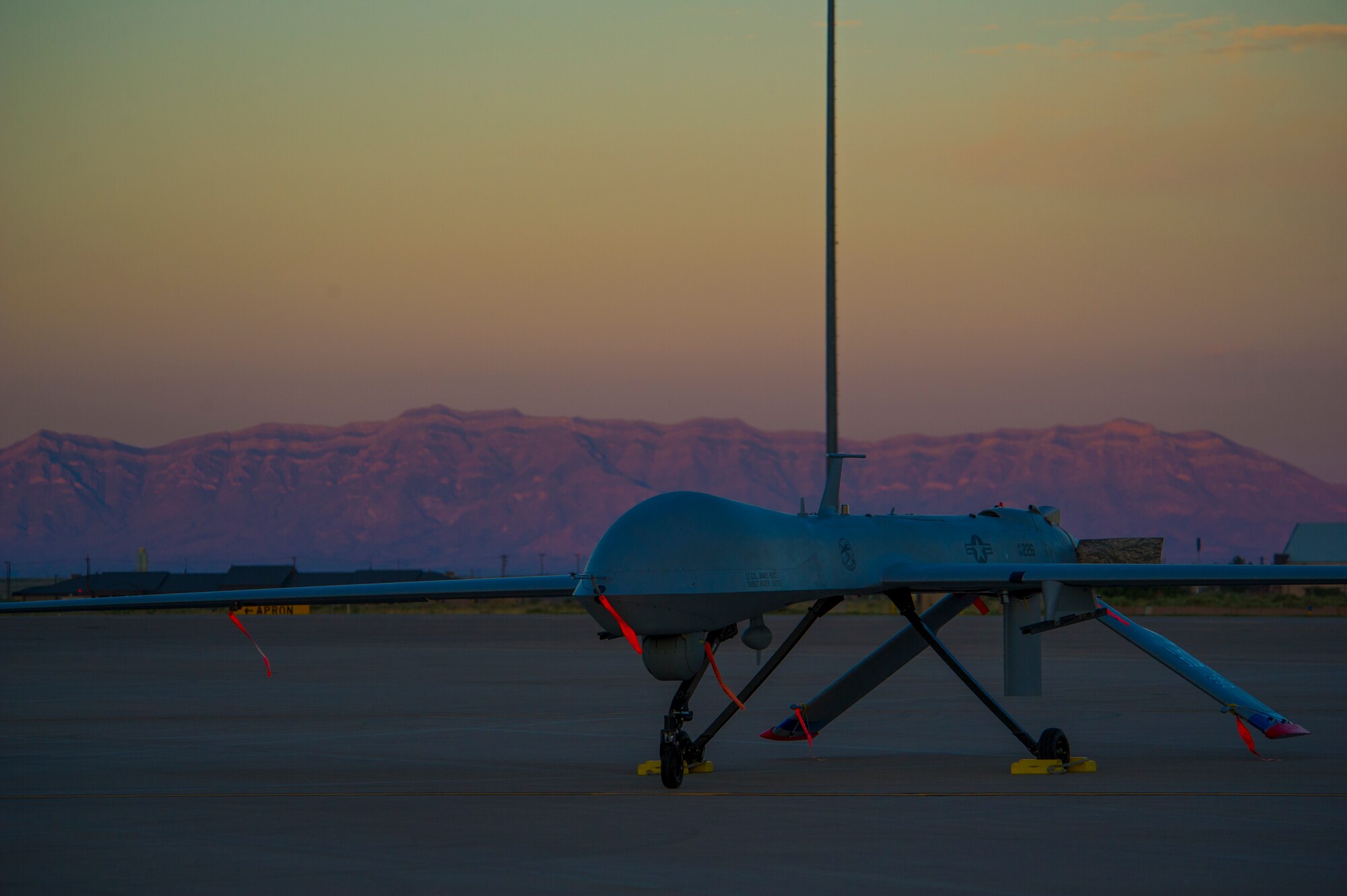 An MQ-1 Predator sits on the flight line of Holloman Air Force Base, N.M., Aug. 19, prior to maintenance that will keep it flying and training the next generation of Air Force pilots and sensor operators. The MQ-1 is a medium-altitude, long-endurance, unmanned aircraft system. The MQ-1's primary mission is interdiction and conducting armed reconnaissance against critical, perishable targets. When the MQ-1 is not actively pursuing its primary mission, it acts as the Joint Forces Air Component Commander-owned theater asset for reconnaissance, surveillance and target acquisition in support of the Joint Forces commander.(U.S. Air Force photo by Airman 1st Class Aaron Montoya/Released)