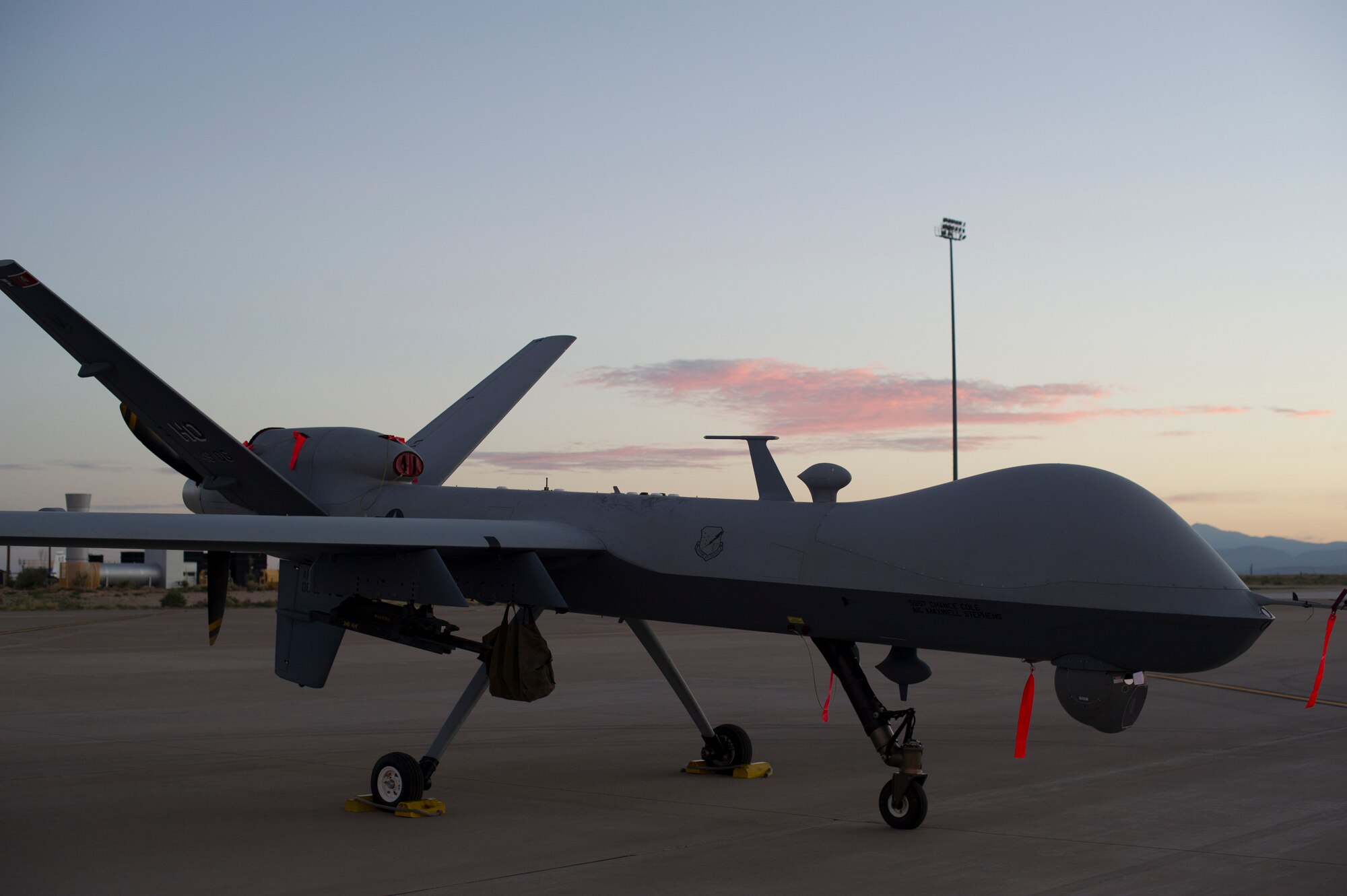 An MQ-9 Reaper sits on the flight line of Holloman Air Force Base, N.M., Aug. 19, prior to maintenance that will keep it flying and training the next generation of Air Force pilots and sensor operators. The MQ-9 Reaper is a medium-to-high altitude, long endurance unmanned aircraft system. The MQ-9's primary mission is as a persistent hunter-killer against emerging targets to achieve joint force commander objectives. The MQ-9's alternate mission is to act as an intelligence, surveillance and reconnaissance asset, employing sensors to provide real-time data to commanders and intelligence specialists at all levels.(U.S. Air Force photo by Airman 1st Class Aaron Montoya/Released)