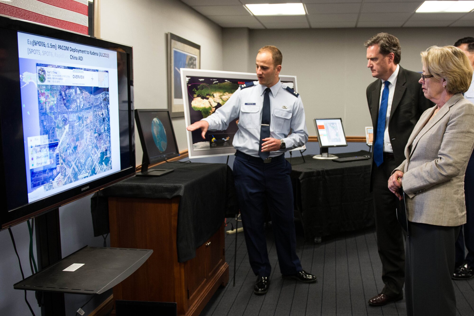 HANSCOM AIR FORCE BASE, Mass. – Capt. Benjamin A. Garoutte, Eagle Vision deputy program manager, highlights Eagle Vision imagery to U.S. Reps. Michael Turner of Ohio and Niki Tsongas of Massachusetts, during a visit here Aug. 19. Turner and Tsongas came to Hanscom and the adjacent MIT Lincoln Laboratory for briefings and demonstrations after doing much the same at Wright-Patterson AFB in Ohio the previous day. (U.S. Air Force photo by Mark Herlihy)