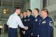 New York Air National Guard Col. Greg Semmel (left), 174th Attack Wing commander, congratulates new wing Inspector General members. The inspector general team will prepare wing members for future basewide inspections. (New York Air National Guard Photo By Tech. Sgt. Justin A. Huett)
