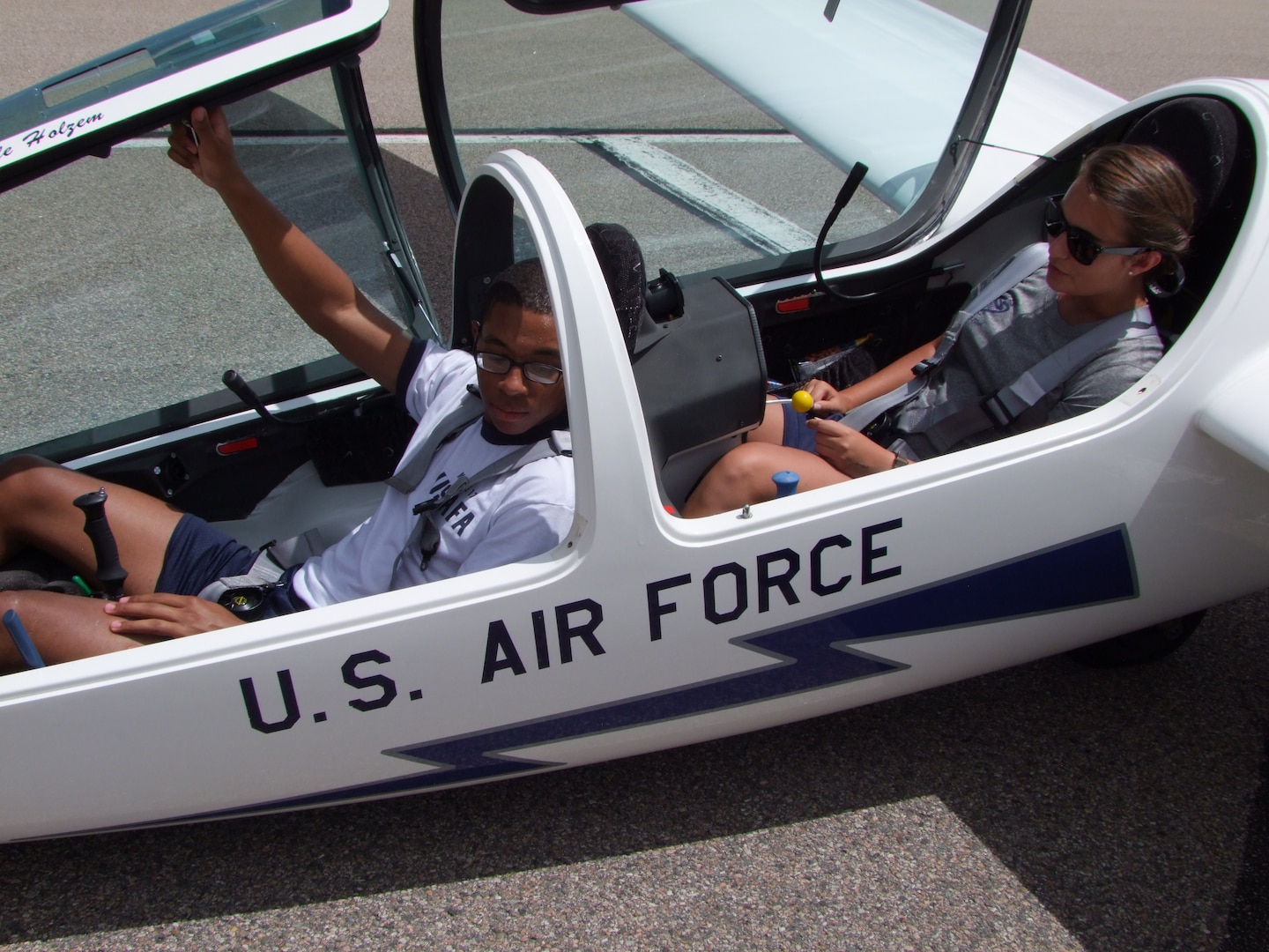 Cadet 3rd Class Kenneth McGhee, upgrader (front seat), and Cadet 2nd Class Miranda Mila instructor pilot (back seat), prepare for a training flight in a TG-16A glider Aug.15. (U.S. Air Force photo/Amber Baillie)