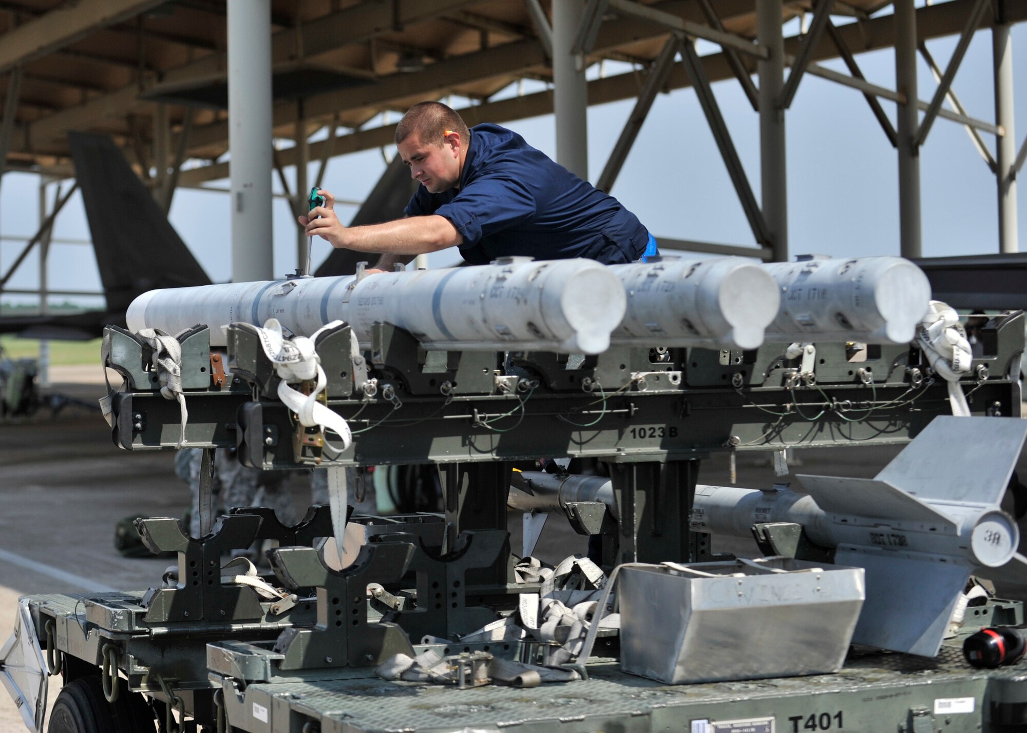 Airman 1st Class Jacob Lutcavish, 95th Aircraft Maintenance Unit weapons load crew apprentice, works on a weapons system Aug. 14 at Tyndall Air Force Base, Fla.  Lutcavish participated in a week-long exercise designed to test 325th Fighter Wing readiness. (U.S. Air Force photo by Airman 1st Class Sergio A. Gamboa) 
