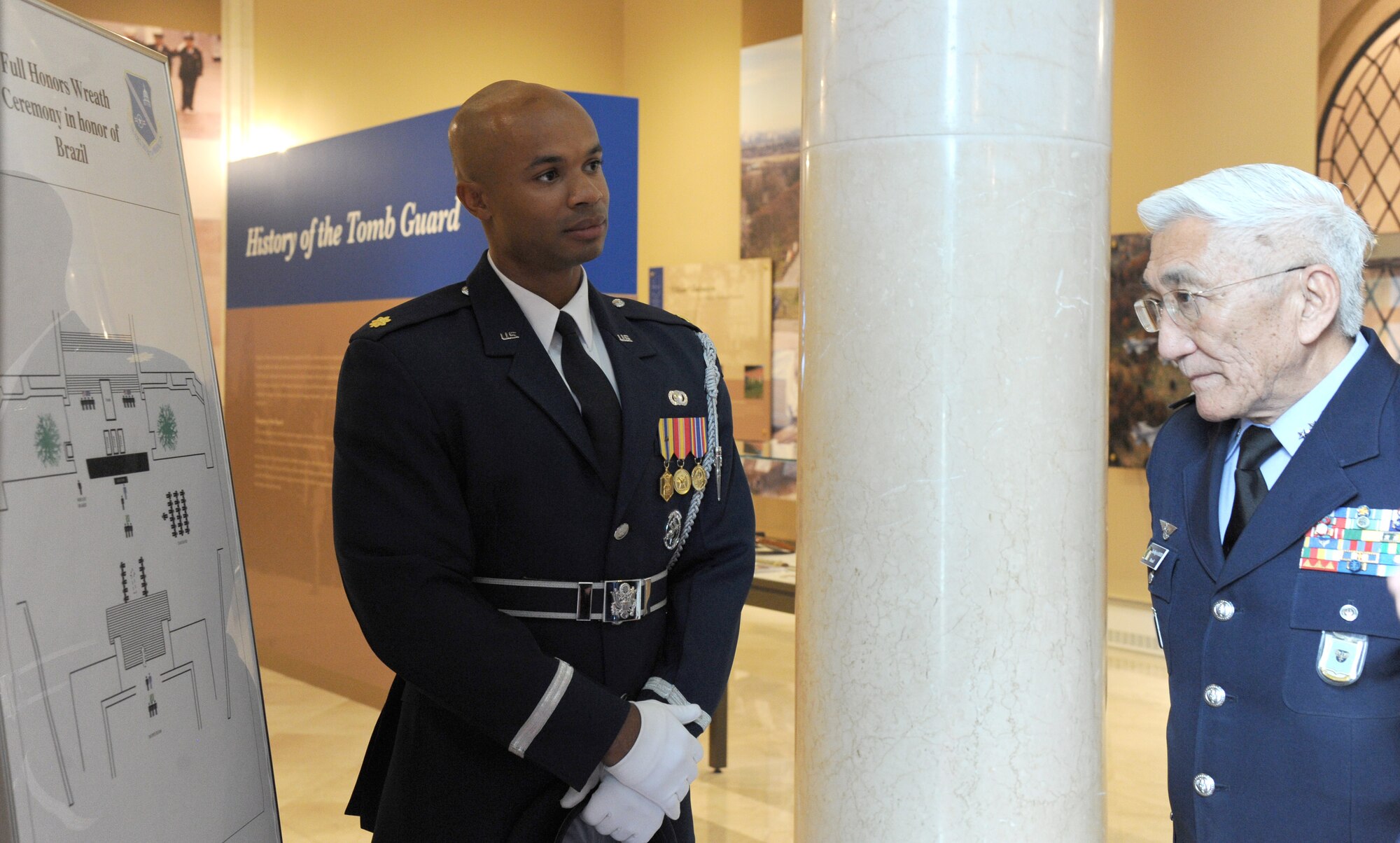 Maj. Scott Belton briefs the full-honors wreath ceremony sequence of events to Brazilian Air Force Commander Gen. Juniti Saito at Arlington National Cemetery in Arlington, Virginia, Aug. 19, 2014. In 2011, Saito received the U.S. Defense Department’s Legion of Merit Medal to recognize his contributions to strengthening the interoperability, cooperation and friendship between the U.S. and Brazilian Air Forces, and for his role in leading Brazil’s military air support to international relief efforts in Haiti following the 7.0 magnitude earthquake that devastated the nation the year prior. Belton is the U.S. Air Force Honor Guard assistant director of operations. (U.S. Air Force photo/Master Sgt. Tammie Moore)