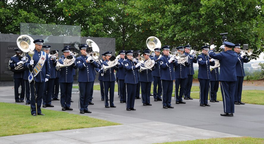 Capt. Capt. David A. Alpar leads Airmen from the U.S. Air Force Band’s Ceremonial Brass through a performance during a full-honors arrival ceremony in honor of Brazil at the Air Force Memorial in Washington, D.C., Aug. 19, 2014. The bandsmen preformed the U.S. and Brazilian national anthems during the ceremony. The ensemble supports state arrivals at the White House, full-honor arrivals for foreign dignitaries, patriotic programs, and change of command, retirement and awards ceremonies. Alpar is the officer in charge of the Concert Band and Singing Sergeants (U.S. Air Force photo/Master Sgt. Tammie Moore)