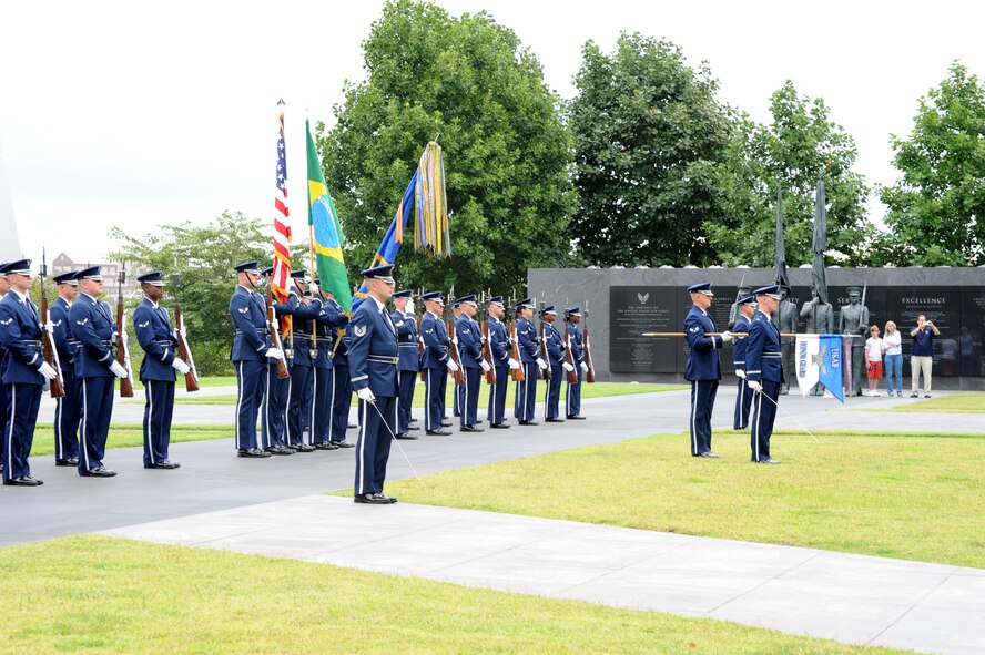 U.S. Air Force Honor Guard Airmen present the colors at the Air Force Memorial in Washington, D.C., as part of a full-honors arrival ceremony honoring Brazil and welcoming Brazilian Air Force Commander Gen. Juniti Saito to the United States Aug. 19, 2014. The U.S. Air Force Honor Guard’s ceremonial flights perform an average of 10 ceremonies per day, and more than 2,500 ceremonies annually. (U.S. Air Force photo/Master Sgt. Tammie Moore)