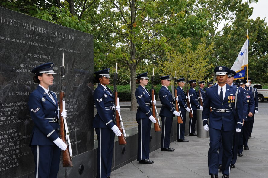 Maj. Scott Belton escorts the official party through a cordon of U.S. Air Force Honor Guard members during a full-honors arrival ceremony in honor of Brazil at the Air Force Memorial in Washington, D.C., Aug. 19, 2014. The U.S. Air Force Band and Honor Guard participated in the welcoming of Brazilian Air Force Commander Gen. Juniti Saito to the United States. Belton is the U.S. Air Force Honor Guard assistant director of operations. (U.S. Air Force photo/Master Sgt. Tammie Moore)