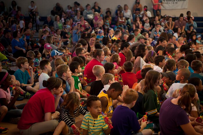 Nellis, Creech and Nevada Test and Training Range members watch a Sesame Street/USO Experience for Military Families show at Nellis Air Force Base, Nev., Aug. 15, 2014. The show was created in 2008 to help service members and their families ‪deal with the unique challenges they face, such as deployments, homecomings and frequent relocations. (U.S. Air Force photo by Staff Sgt. Siuta B. Ika)‬‬‬‬‬‬