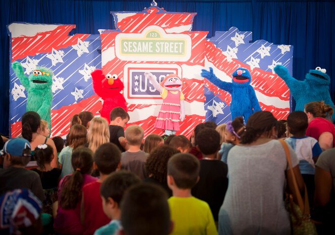 Members of the Sesame Street/USO Experience for Military Families perform for Airmen and their families at the Youth Center, Nellis Air Force Base, Nev., Aug. 15, 2014. The show emphasized the importance of adjusting to change and the power of friendship. (U.S. Air Force photo by Staff Sgt. Siuta B. Ika)