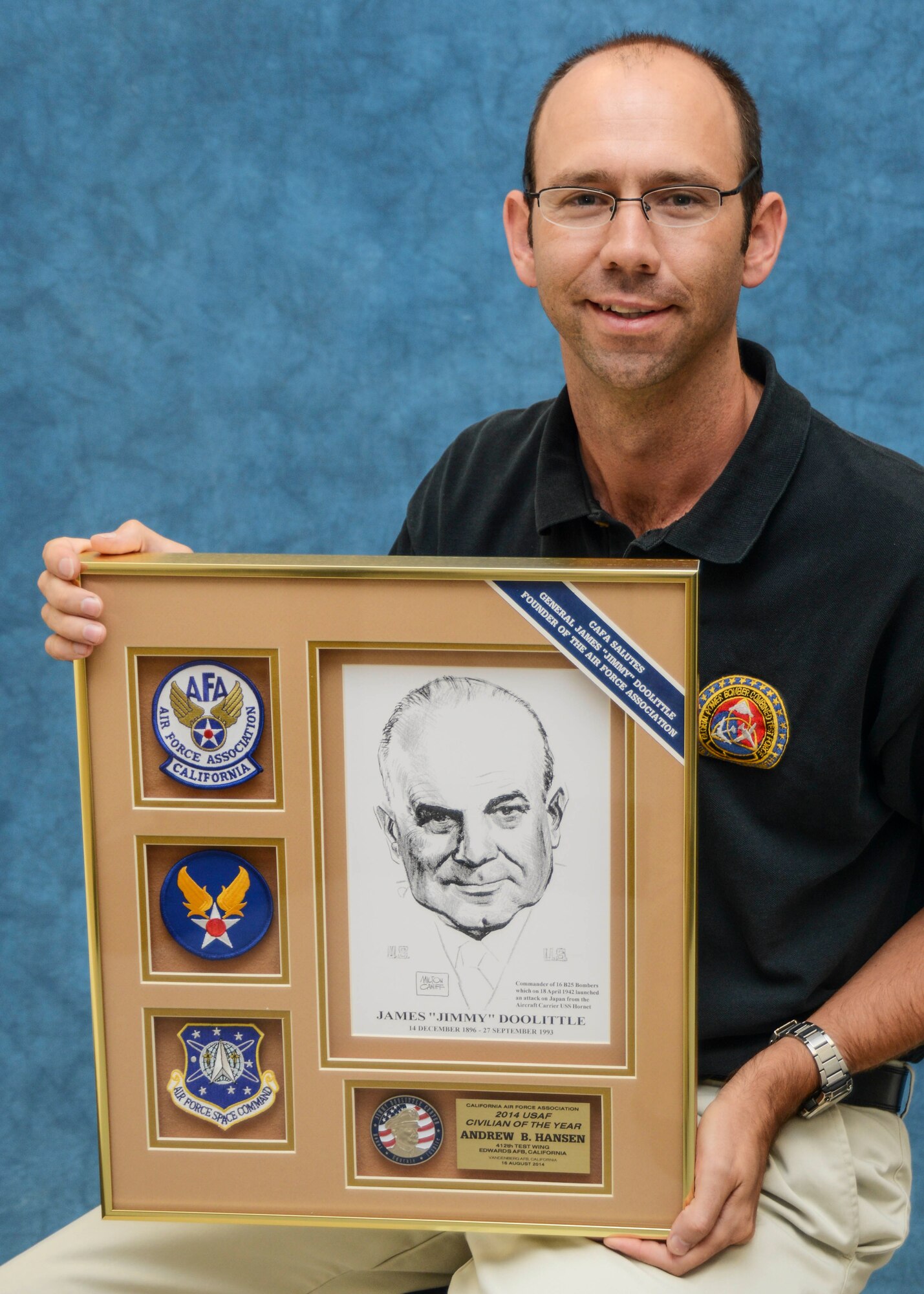 Andrew Hansen, 412th Test Wing Range Safety engineer, was named the U.S. Air Force Civilian of the Year for 2014. The plaque presented by the California Air Force Association features famous aviator Gen. James Doolittle, founder of the Air Force Association. (U.S. Air Force photo by Rebecca Amber) 