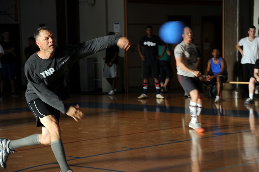 Lt. Col. Matt Boschert, Air War College student, gives his all at the Maxwell-Gunter Dodge Ball Tournament at Maxwell Air Force Base, Ala., Aug. 15, 2014.Boschert was playing for the Niners.( U.S Air Force photo by Airman 1st Class Alexa Culbert)