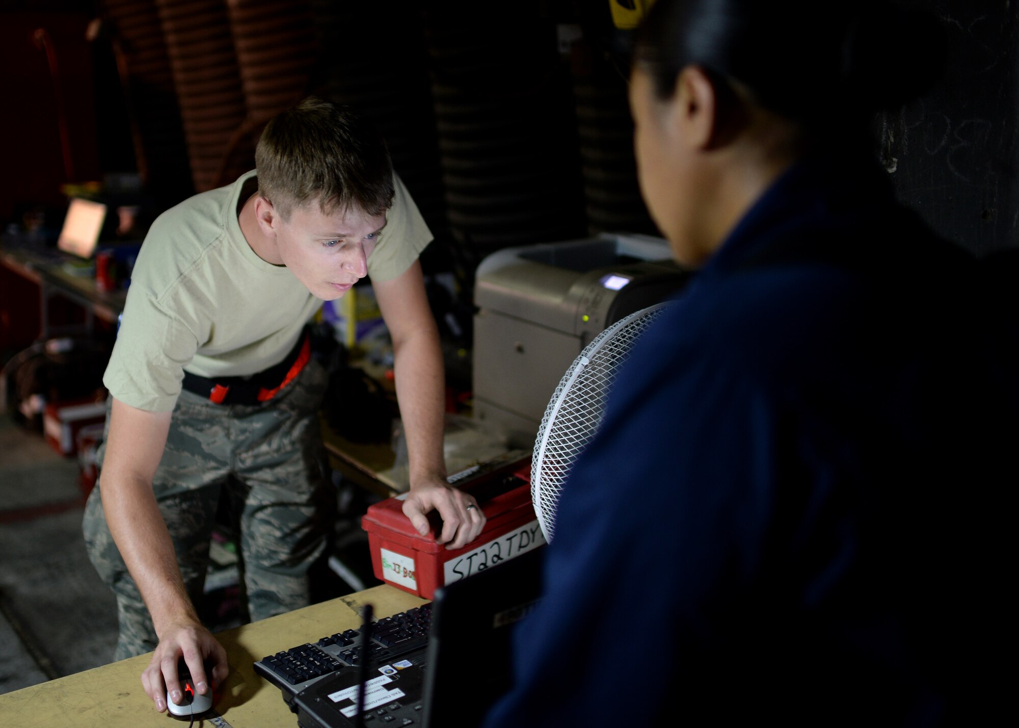 U.S. Air Force Senior Airman Coleman Haynes, 52nd Aircraft Maintenance Squadron support technician and native of Nevis, Minn., checks out equipment to U.S. Air Force Staff Sgt. Dionne Williams, 52nd AMXS 480th Aircraft Maintenance Unit jet engine technician and native of Honolulu, Hawaii, at the squadron's supply area in Souda Bay, Greece, Aug. 20, 2014. The launch expectation during the bilateral training between the Hellenic and U.S. air forces is 22 sorties a day, which then requires the constant work of maintenance technicians to sustain aircraft readiness to meet the mission needs. (U.S. Air Force photo by Staff Sgt. Daryl Knee/Released)
