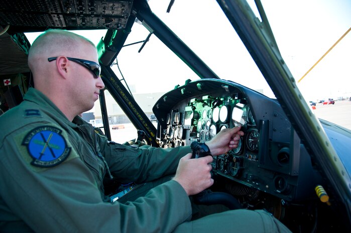 Capt. Samuel Shamburg, 40th Helicopter Squadron instructor pilot, sets the pressure altitude on an altitude indicator prior to flight Aug 11. The indicator assures the helicopters have proper altitude readings above sea level, allowing for safe flight when around other aircraft. (U.S. Air Force photo/Airman 1st Class Collin Schmidt)