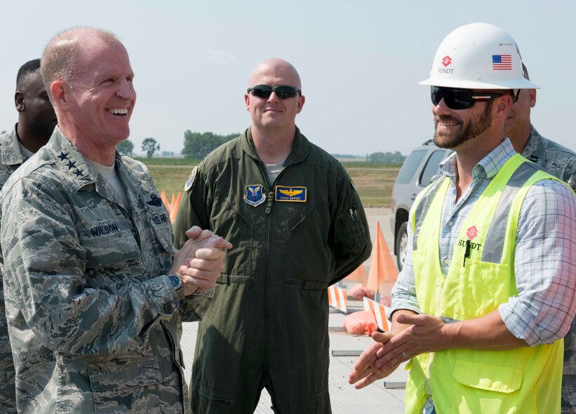 Air Force Global Strike Command commander Lt. Gen. Stephen Wilson speaks with contractors on Minot Air Force Base, N.D., Aug. 19, 2014. During his visit Wilson received updates on the progress of runway construction, slated for completion in early October. (U.S. Air Force photos/Airman 1st Class Sahara L. Fales)