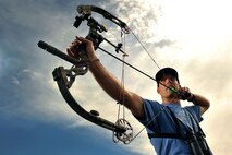 Tim Paget takes aim at the Schriever Archery Range Aug. 19, 2014. Paget hit a 10-inch target from 65 yards out in the final round to win the second annual Schriever Archery Competition and repeat as a champion. (U.S. Air Force photo/Dennis Rogers)