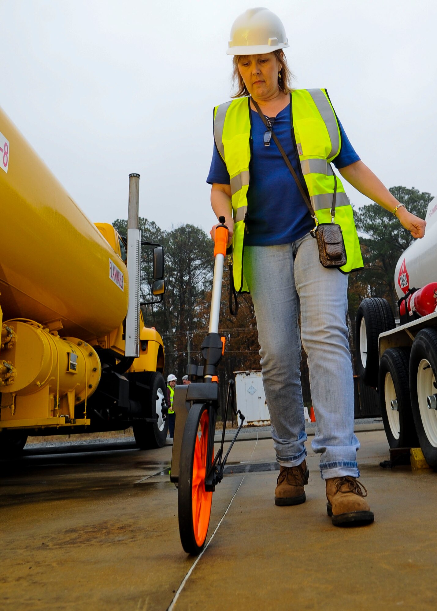 Heidi Smith, 733rd Civil Engineer Division property officer, measures property assets at Fort Eustis, Va., Dec. 5, 2013. The 733rd CED's installation data collection aids the U.S. Army with budget analysis, which saves money for the installation. Smith hails from Burt, Mich. (U.S. Air Force photo by Airman 1st Class Austin Harvill/Released)