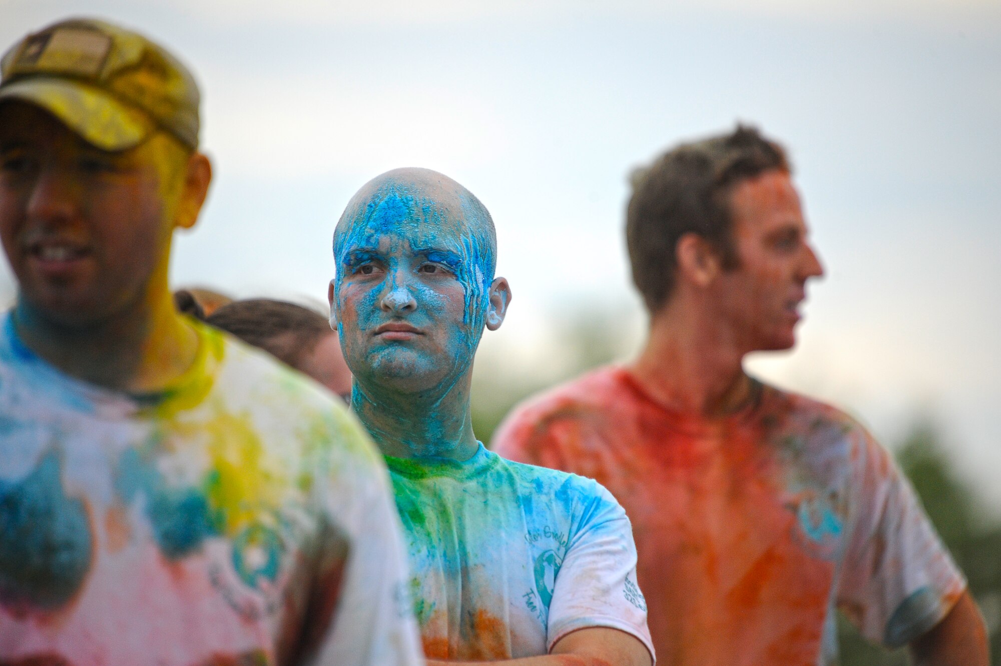 GOODFELLOW AIR FORCE BASE, Texas – Sexual Assault Prevention and Response Color Race finishers show off their colors as the event comes to an end Aug. 16. Volunteers threw varying colors of powder on the runners during the race. (U.S.  Air Force photo/ Staff Sgt. Austin Knox)