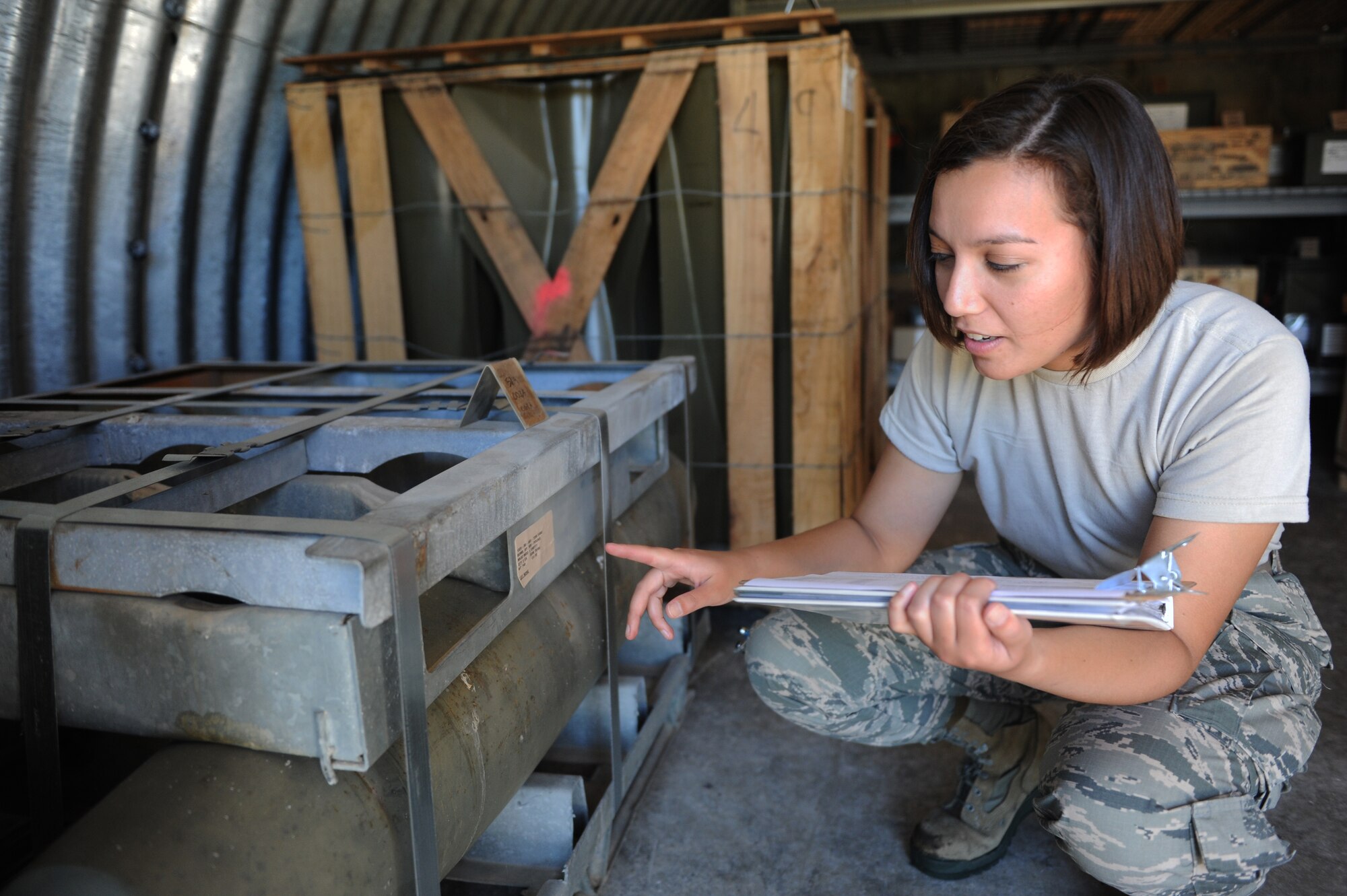 Airman 1st Class Andrea Rhoads, 375th Logistics Readiness Squadron munitions crewmember, conducts a periodic inventory Aug. 8, 2014, at Scott Air Force Base, Ill. The munitions flight checks ten percent of their inventory each month. (U.S. Air Force photo/Staff Sgt. Clayton Lenhardt/Released)