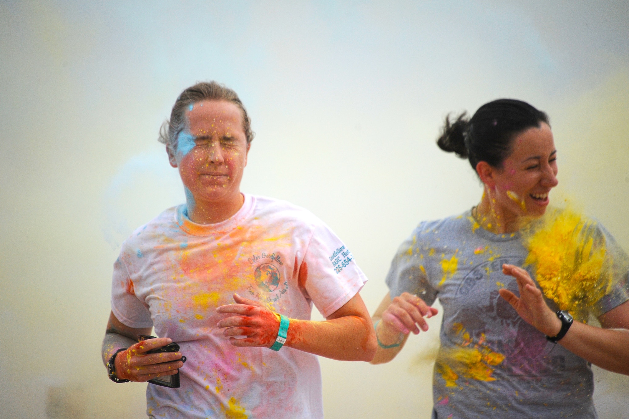 GOODFELLOW AIR FORCE BASE, Texas – Participants run through blasts of colored powder during the second annual Sexual Assault Prevention and Response Color Race Aug. 16. SAPR hosted the 5K run to promote awareness of sexual assault prevention.  (U.S.  Air Force photo/ Staff Sgt. Austin Knox)