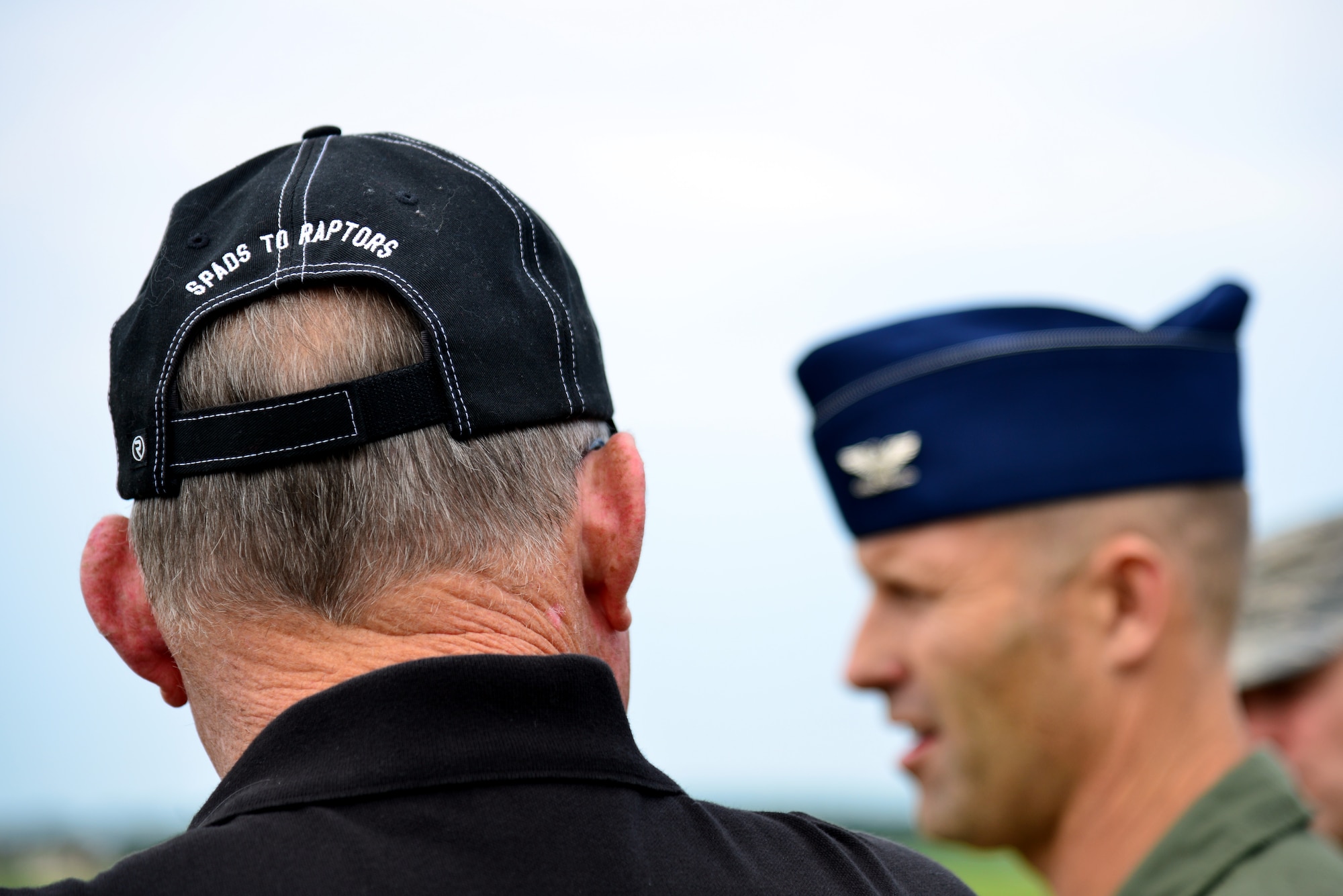 U.S. Air Force Col. Kevin Huyck, 1st Fighter Wing commander, speaks to Col. (Ret.) James Hardenbrook, 1st Fighter Wing Association president emeritus and F-15 static display project manager, about an F-15 Eagle static display at Langley Air Force Base, Va., Aug. 7, 2014. The association donated the funds needed to place the aircraft on display at the intersection of Sweeney Boulevard and Lee Road, near the West Gate. Base patrons should expect construction to begin in early September and last until November. (U.S. Air Force photo by Senior Airman Aubrey White/Released) 