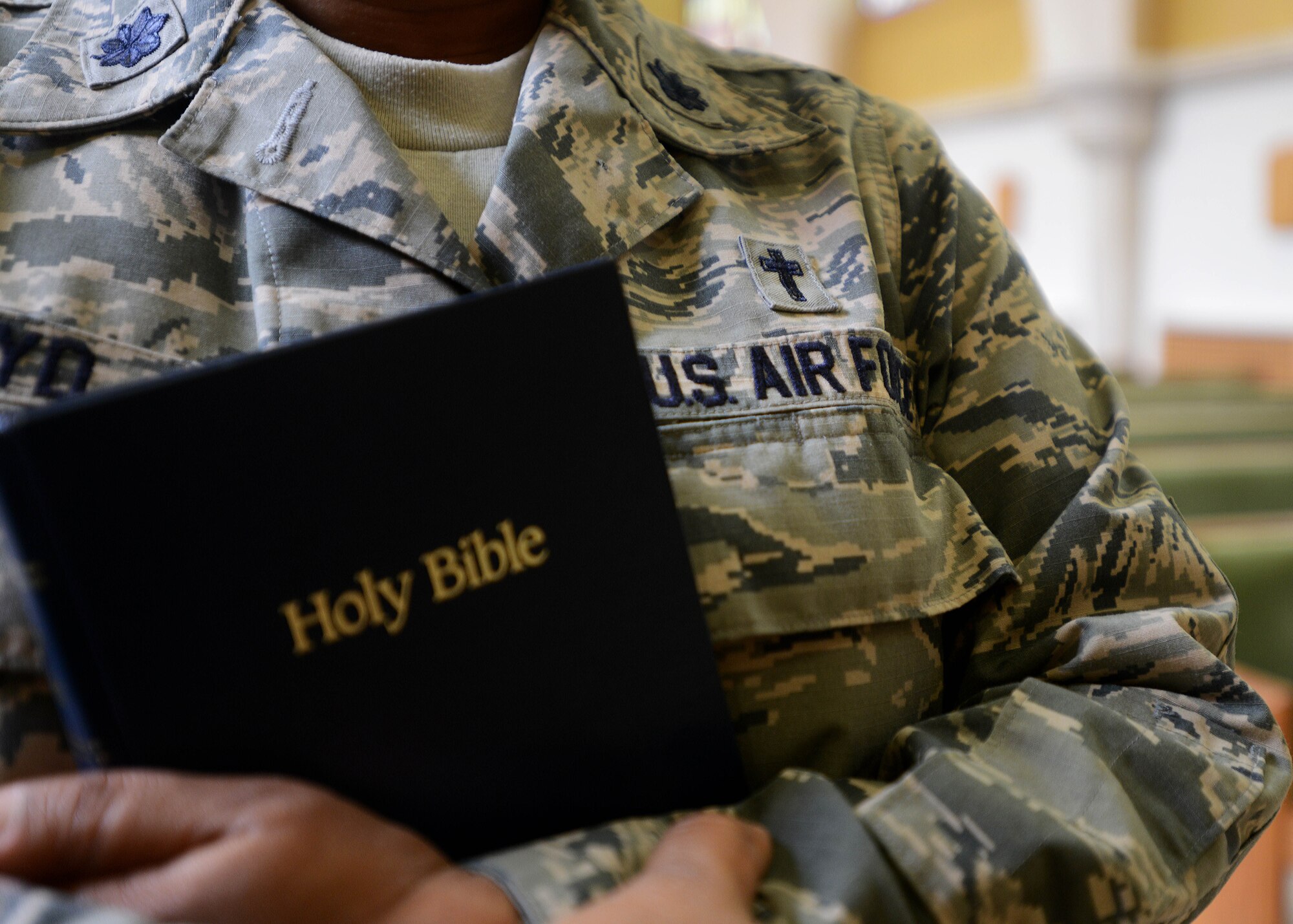 Chaplain (Lt. Col.) Donnette Boyd, 31st Fighter Wing chaplain, wears the patch of a Christian cross on her uniform to identify her as a chaplain, Aug. 18, 2014, at Aviano Air Base, Italy. During her upbringing, religion and church were not a part of her daily life; however, she became a strong believer after discovering how to pray on her own. Throughout college and her first few duty stations, she was still skeptical about religion. (U.S. Air Force photo/Airman 1st Class Deana Heitzman)  