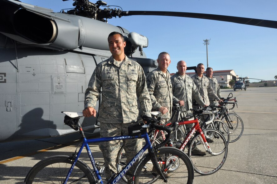 Members from the 920th Maintenance Squadron pose for a picture on the flightline, Patrick Air Force Base, Fla., August 19, 2014. The members are part of a cycling club and plan to participate in the Rocketman Florida Triathlon, October 12, 1014. (U.S. Air Force photo/ Tech. Sgt. Katie Spencer) 