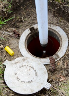 Survey monuments are permanent plotting points on RAF Mildenhall, England. The permanent spots are used as a starting point while plotting points for base maps. (U.S. Air Force photo/Airman 1st Class Victoria H. Taylor/Released)
