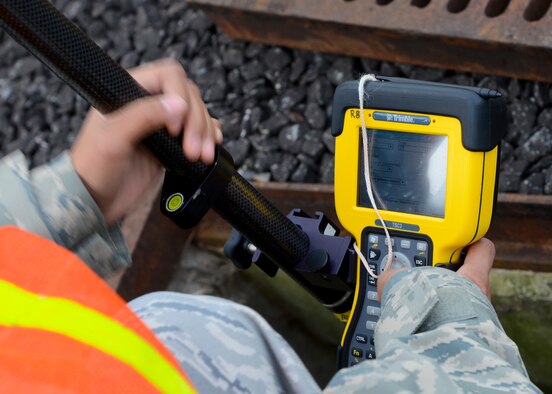 U.S. Air Force Airman 1st Class Abigail Slater, 100th Civil Engineer Squadron engineering assistant from Fairfax, Va., inputs data into the portable global network satellite system receiver Aug. 18, 2014, on RAF Mildenhall, England. The receiver uses wireless technology to precisely plot points on base. (U.S. Air Force photo/Airman 1st Class Victoria H. Taylor/Released)