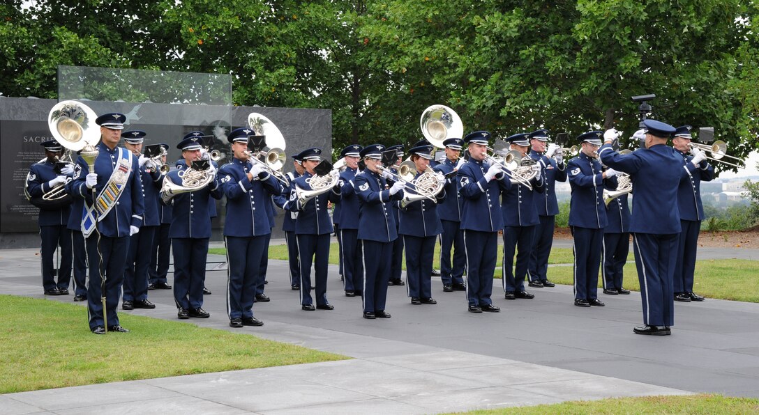 Capt. Capt. David A. Alpar leads Airmen from the U.S. Air Force Band’s Ceremonial Brass through a performance during a full-honors arrival ceremony in honor of Brazil at the Air Force Memorial in Washington, D.C., Aug. 19, 2014. The bandsmen preformed the U.S. and Brazilian national anthems during the ceremony. The ensemble supports state arrivals at the White House, full-honor arrivals for foreign dignitaries, patriotic programs, and change of command, retirement and awards ceremonies. Alpar is the officer in charge of the Concert Band and Singing Sergeants (U.S. Air Force photo/Master Sgt. Tammie Moore)