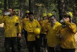 Army National Guard Soldiers working on Hand Crew 9 for the Lodge Fire in Yreka, Calif., take a water break on Aug. 14, 2014. 
