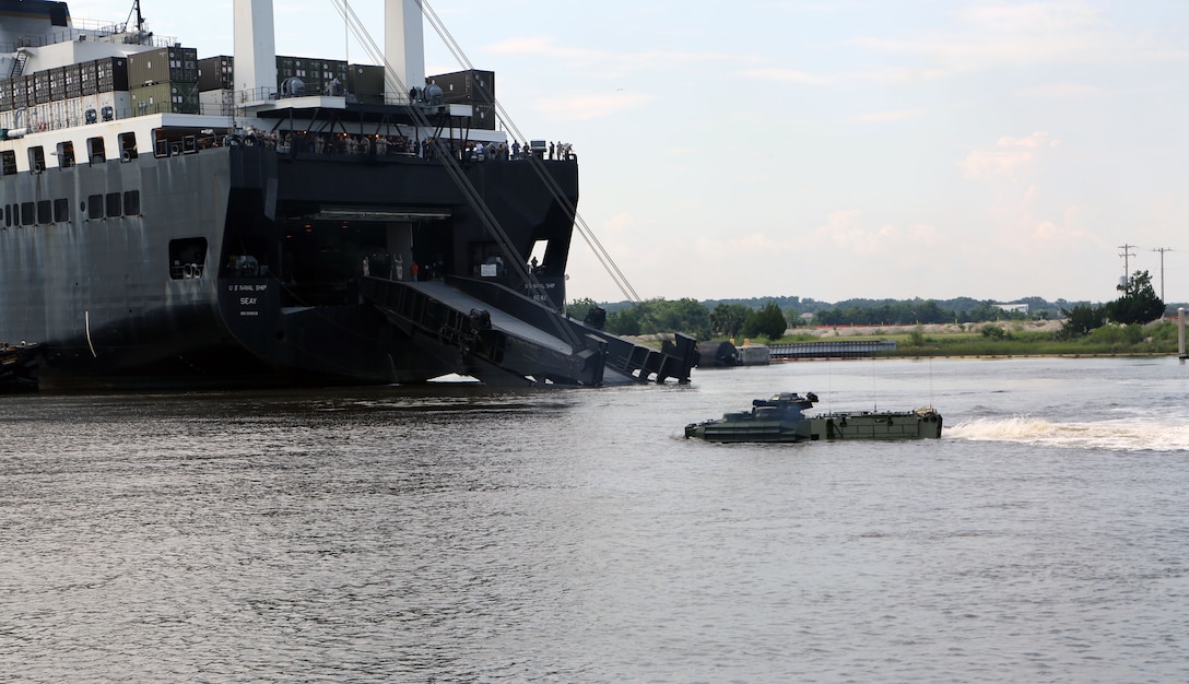 Marines with 4th Assault Amphibian  Battalion, 4th Marine Division, drive an amphibious assault vehicle off the back of the USNS SEAY, a Maritime Prepositioning Ship, at Blount Island in Jacksonville, Fla., Aug. 13, 2014. The Reserve Marines of 4th AAV Bn. conducted the training to increase proficiency in ship-to-shore operations and work on interoperability with the U.S. Navy