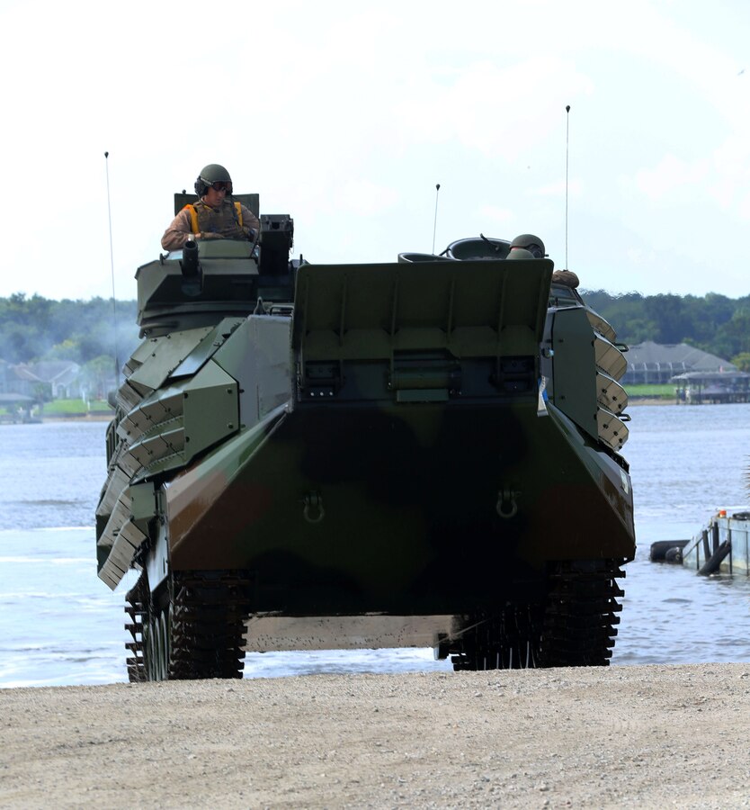 Reserve Marines with 4th Assault Amphibian Battalion, 4th Marine Division, conducted AAV launch training at Blount Island in Jacksonville, Fla., Aug. 13, 2014. The training focused on ship-to-shore operations and interoperability with the U.S. Navy. The Marines drove the AAVs off the ramp of the back of the USNS SEAY (T-AKR-302), a Maritime Prepositioning Ship, then headed back to shore. 