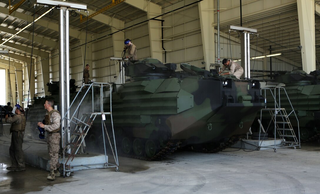 Reserve Marines from 4th Assault Amphibian Battalion, 4th Marine Division, conducted amphibious training on Blount Island in Jacksonville, Fla., Aug. 13, 2014. The Marines splashed off the back of the USNS SEAY (T-AKR-302), a Maritime Prepositioning Ship, then moved the assault vehicle ashore. The AAVs were then taken to the wash rack where the Marines cleaned and made sure they were still in good working order. 
